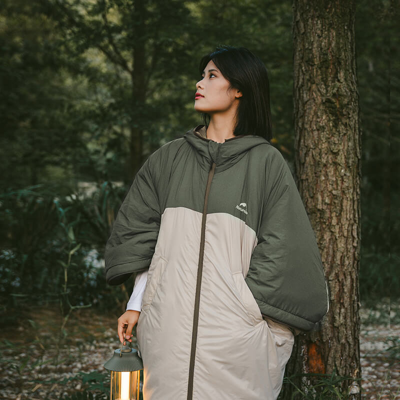 Poncho style sleeping bag coat