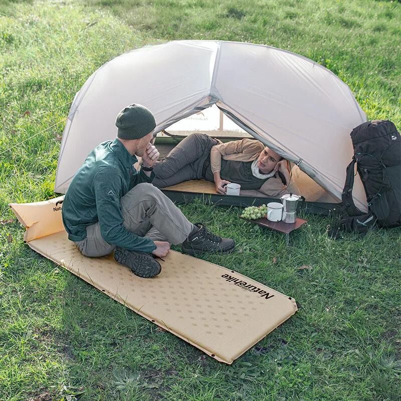 Inflatable camping mattress with built-in pillow